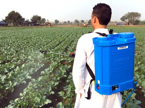 battery sprayer farmer spraying.jpg